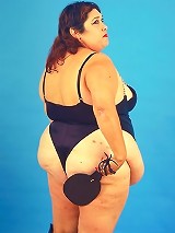 Huge Belly Fat Babe in Dominatrix Look Posing